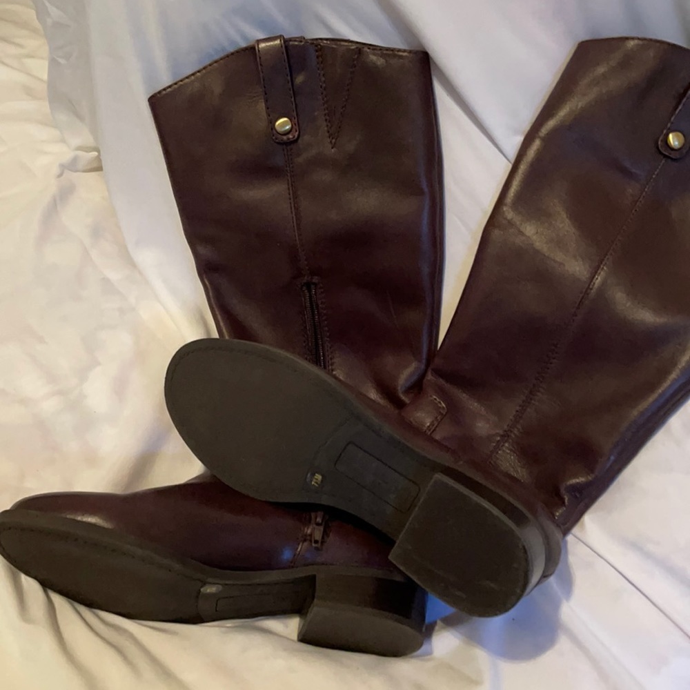 Brown boot. Upper leather like new. Pull on with side zipper. To knee